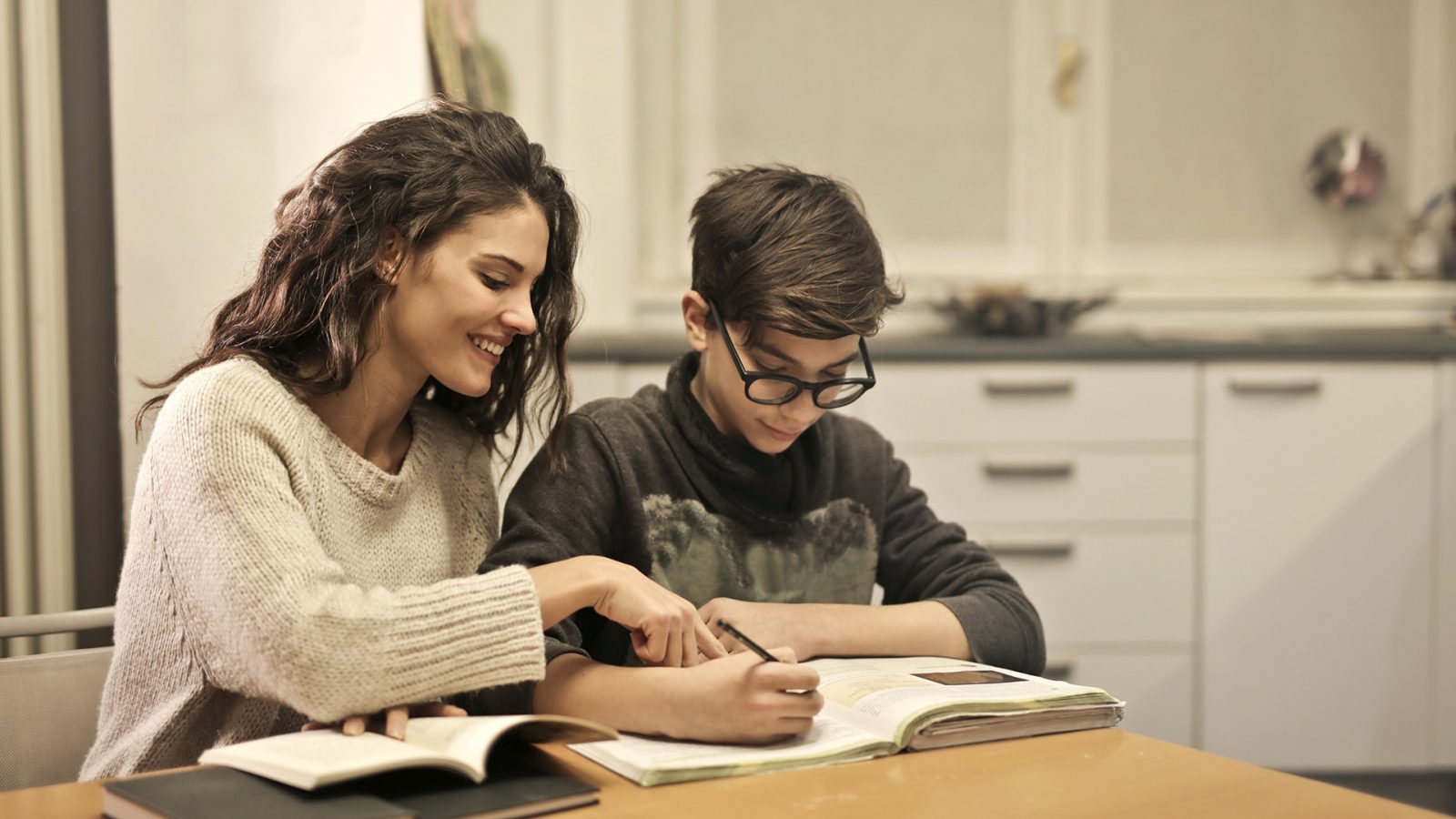 Elder sister and brother studying at home 3769981